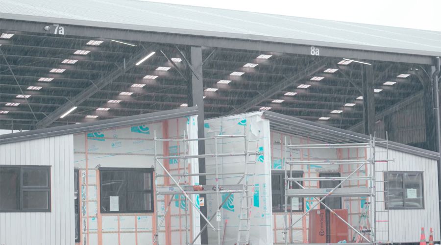 Rain doesn’t slow down construction time at Builtsmart's covered house factories.